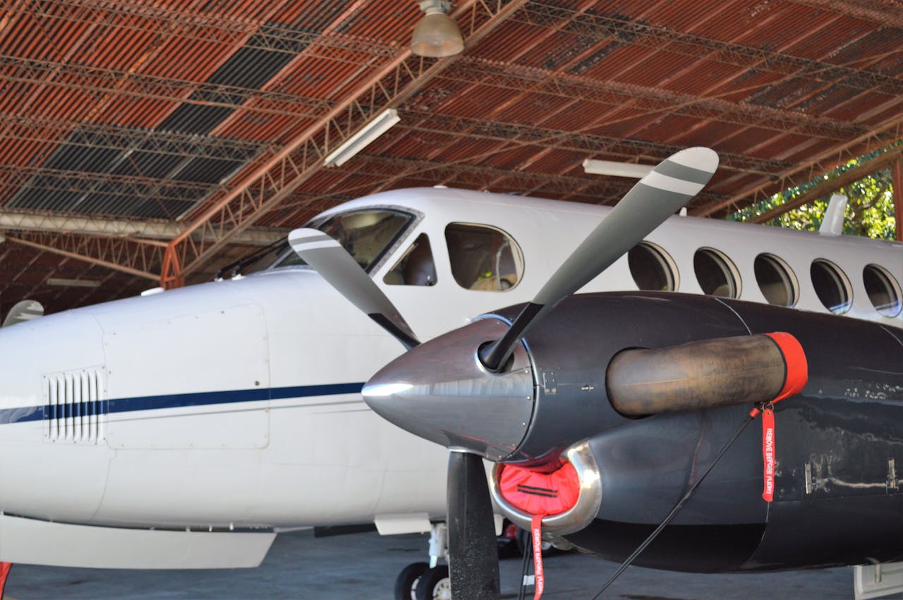 Close-up of a private airplane with a propeller inside a hangar in San Salvador.